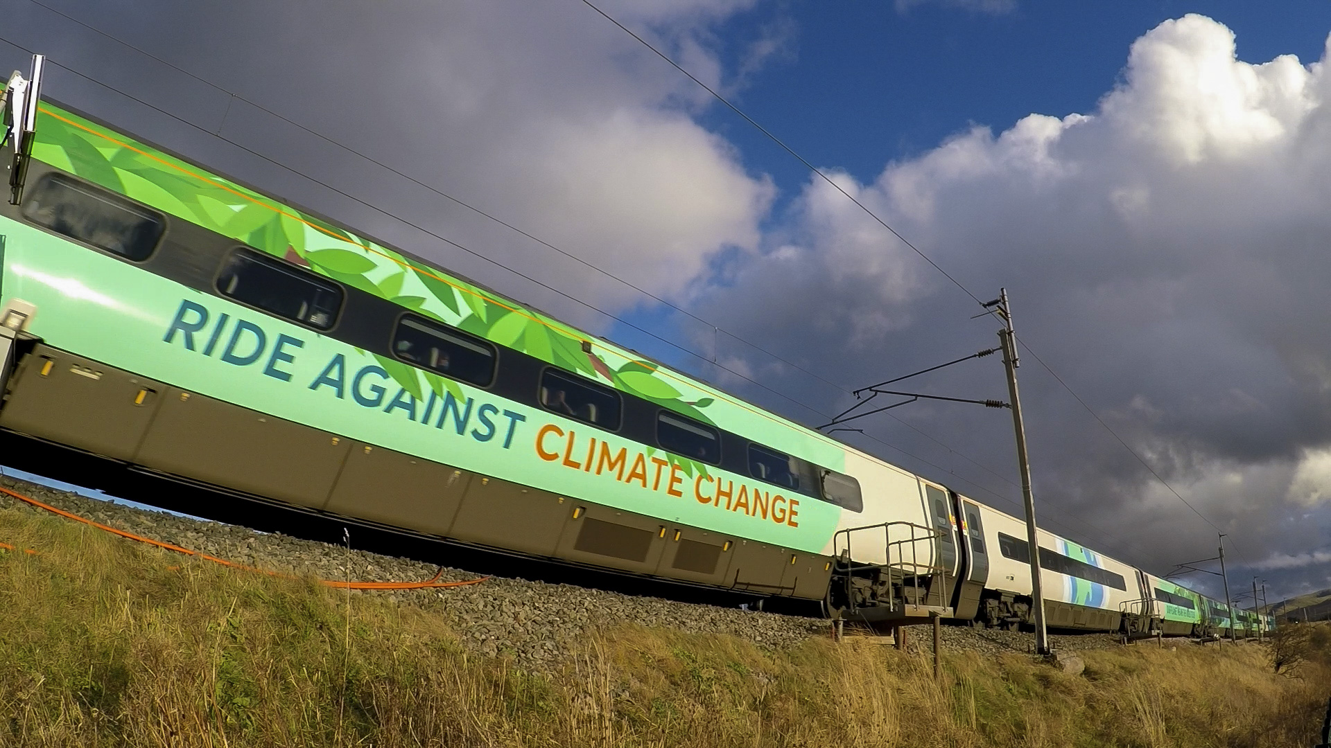 Green train with wording 
